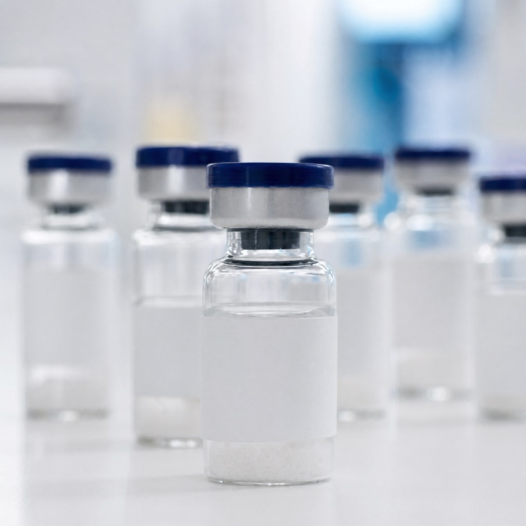 Research peptide vials on a laboratory surface